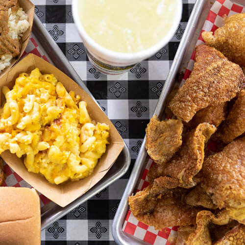 Aerial view of dinner platter with protein and mac and cheese.