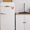Cropped view of Maurice's sticker on fridge.