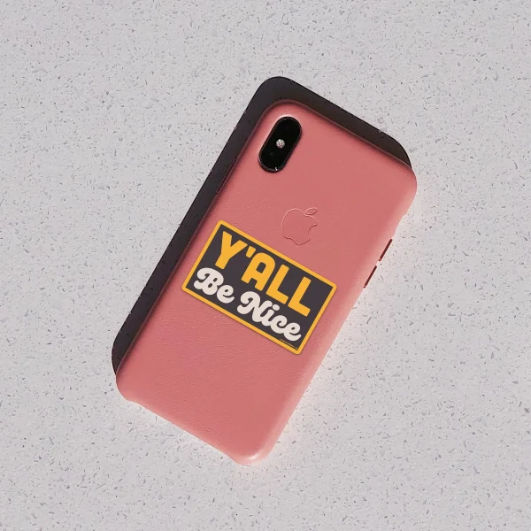 Y'all Be Nice decal on phone.